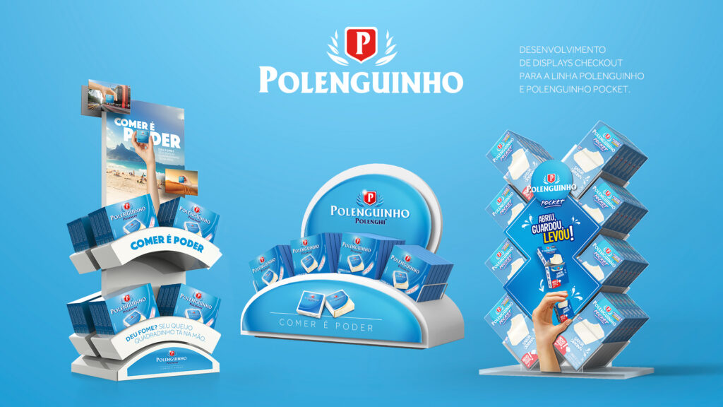 Três modelos de displays de checkout azuis da linha Polenguinho e Polenguinho Pocket com o texto Comer é Poder